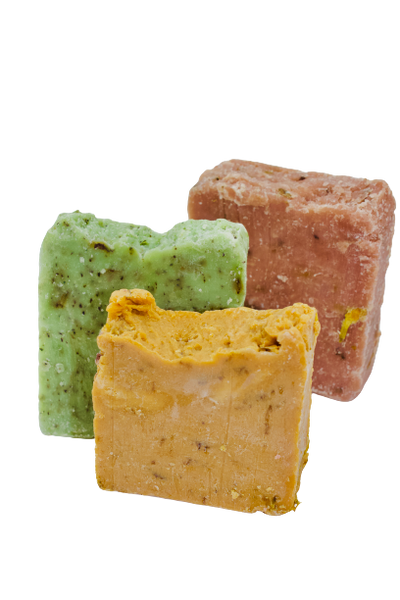 Three bars of soap. Front is the citrus (colored in yellow/orange), second is the mint (green), third is the lavender (purple). 