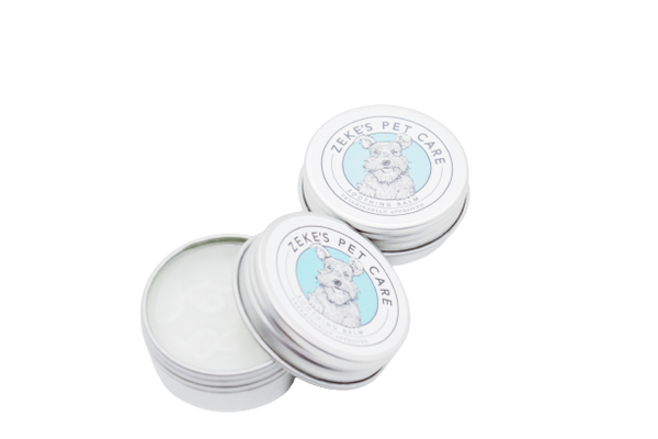Depiction of two pet balms, one with the lid open, one with the lid on.