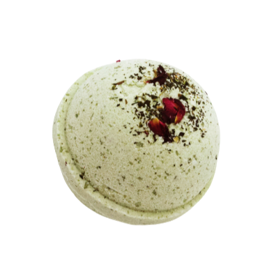 The mint bath bomb, green sphere decorated with dried rose petals.
